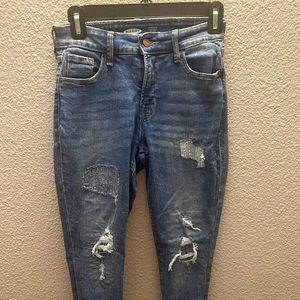 distressed jeans w patterns on the distress